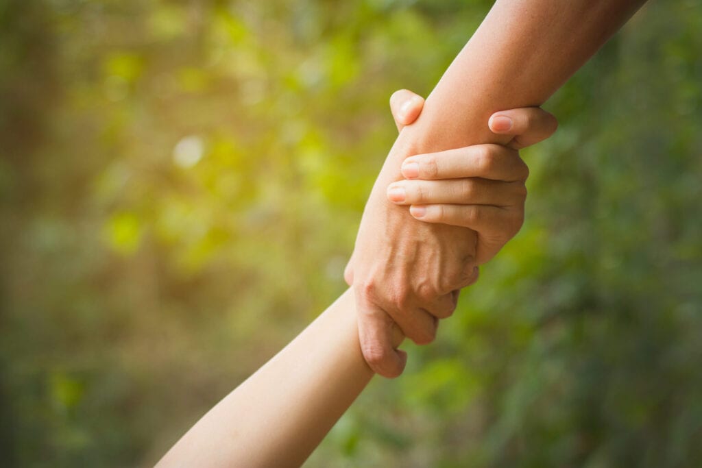 New Hope Ministries holding hands image
